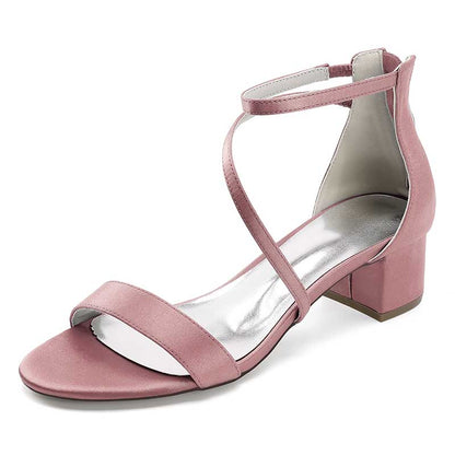 Elegant pink comfortable wedding sandals with chunky heel, featuring sleek straps and a shiny insole