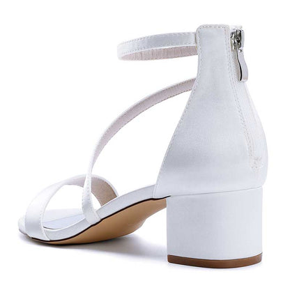 White comfortable wedding sandals with chunky heel featuring adjustable ankle strap for secure fit