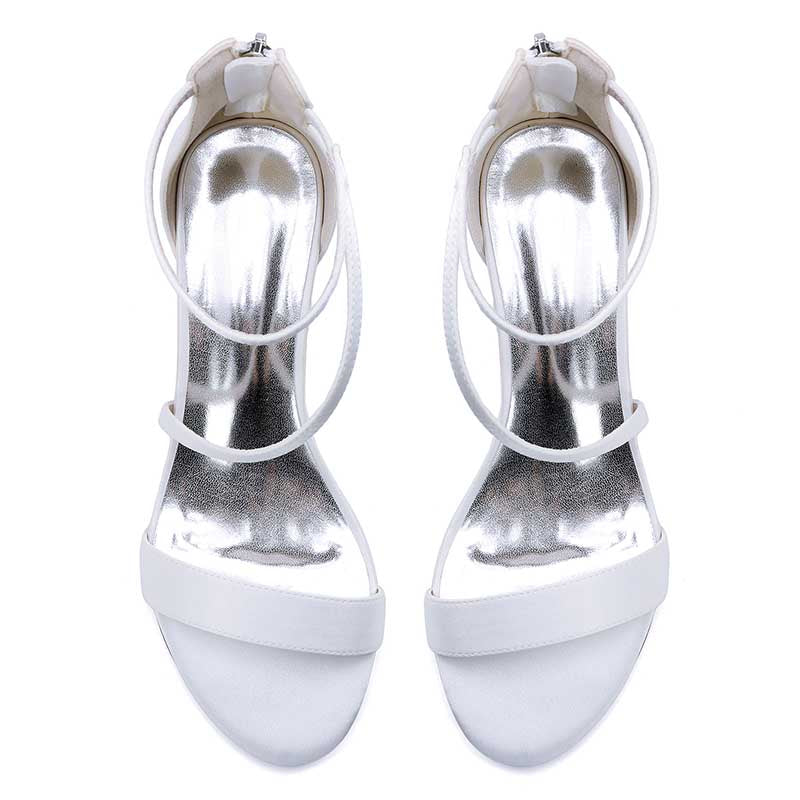 Elegant white comfortable wedding sandals with chunky heel featuring stylish straps and a shiny finish