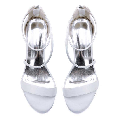 Elegant white comfortable wedding sandals with chunky heel featuring stylish straps and a shiny finish