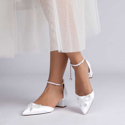 Elegant white comfortable wedding shoes block heel with decorative details and ankle strap