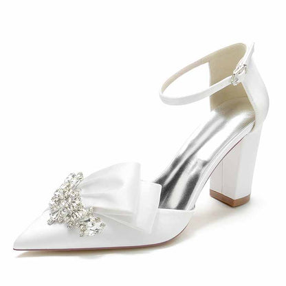 Elegant white S&DCo. comfortable wedding shoes for women with a bow and jeweled embellishment