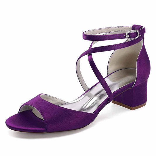 Purple criss cross satin block heel sandals with an elegant ankle strap design