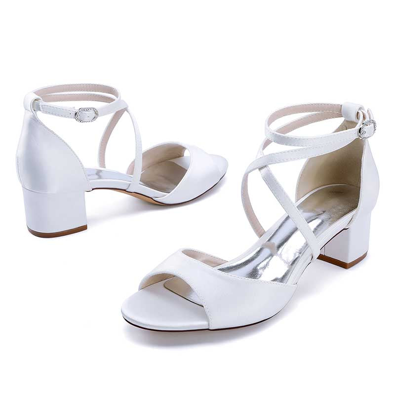 Elegant white criss cross satin block heel sandals with ankle straps for stylish occasions