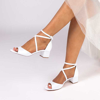 Elegant criss cross satin block heel sandals in white for stylish summer outfits