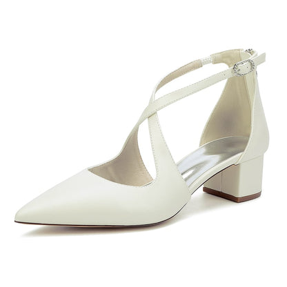 Elegant white cross strap bridal shoes with a stylish block heel for modern brides