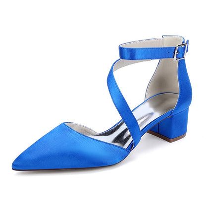 Blue cross strap wedding shoes with a sleek pointed toe and block heel for elegant bridal style