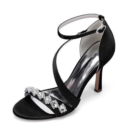 Elegant black cross-strap wedding shoes for brides with embellished detail and a stylish heel
