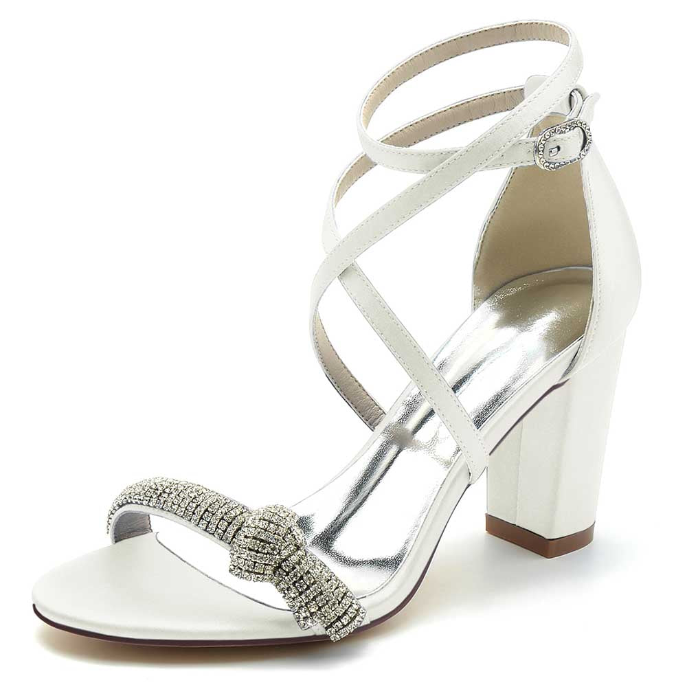 Elegant S&DCo. cross strap wedding shoes for brides with rhinestone bow and block heel
