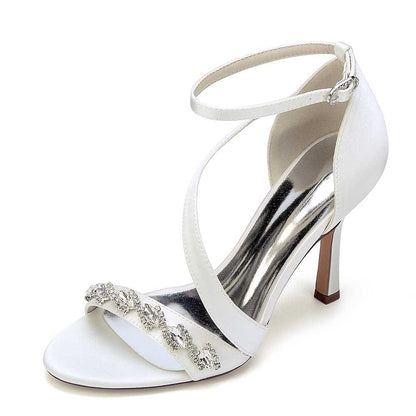 Elegant S&DCo. cross-strap wedding shoes for brides with a sparkling embellishment and a chic heel