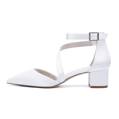 Elegant white cross strap wedding shoes with a block heel designed for bridal comfort and style
