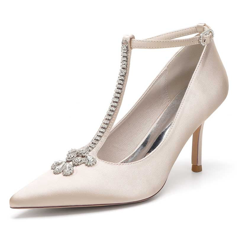 Elegant crystal ankle strap wedding heels in cream satin with a chic pointed toe and sparkling embellishment