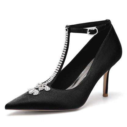 Elegant black crystal ankle strap wedding heels with a pointed toe design and sparkling embellishments