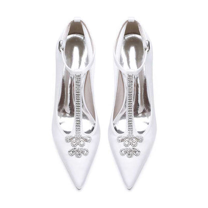 Elegant crystal ankle strap wedding heels in white satin featuring sparkling embellishments