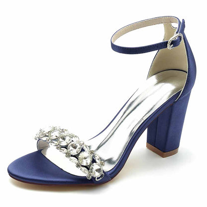 Navy blue crystal chunky heel prom sandals with a shiny ankle strap and embellished upper