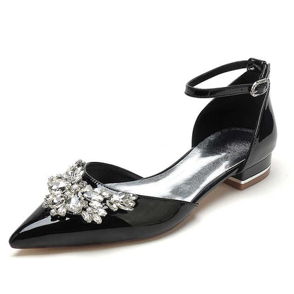 Elegant black crystal embellished flats for women featuring a pointed toe and ankle strap design