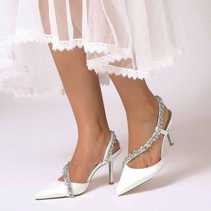 S&DCo. crystal strap bridal heels in white, featuring elegant detailing and a pointed toe design