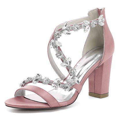 Elegant pink crystal strappy wedding heels featuring floral embellishments and a block heel
