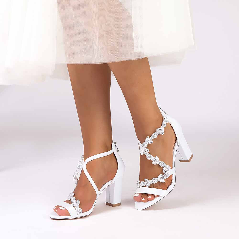 Elegant crystal strappy wedding heels with a block heel and decorative embellishments for bridal style