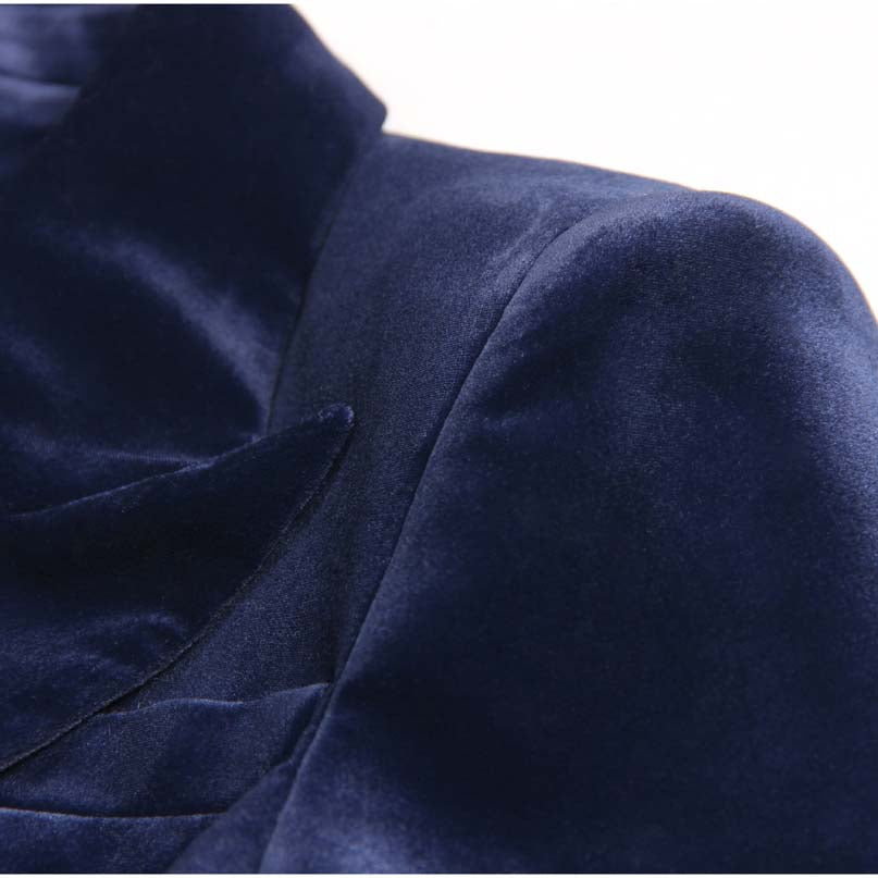 Close-up of a luxurious navy double breasted velvet pantsuit featuring soft velvet fabric and elegant details