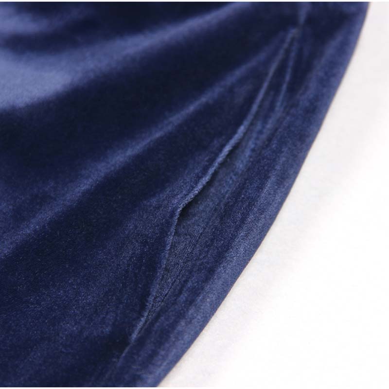 Close-up of navy blue fabric showcasing the luxurious feel of a double breasted velvet pantsuit