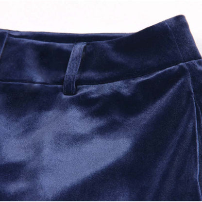Navy blue detail of a double breasted velvet pantsuit showcasing the smooth fabric texture