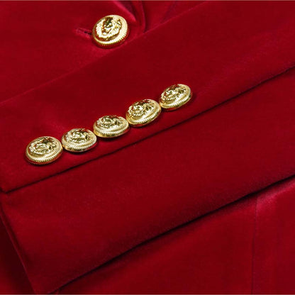 Close-up of gold buttons on a red double breasted velvet pantsuit by SD Dresscode & Fashiontrends