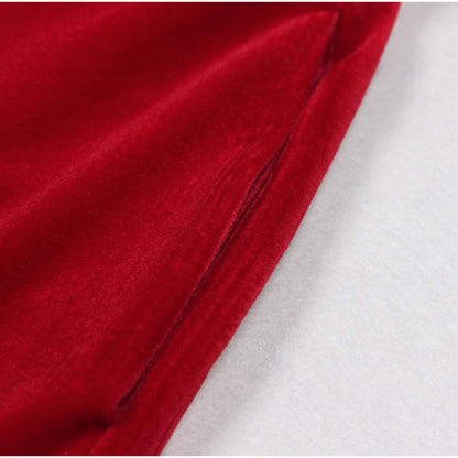 Close-up detail of the sleeve of a red double breasted velvet pantsuit from SD Dresscode & Fashiontrends