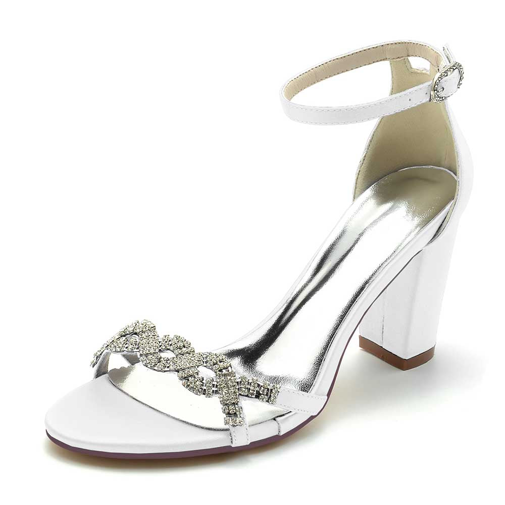 White dressy block heel sandals for weddings with a sparkling embellishment and ankle strap