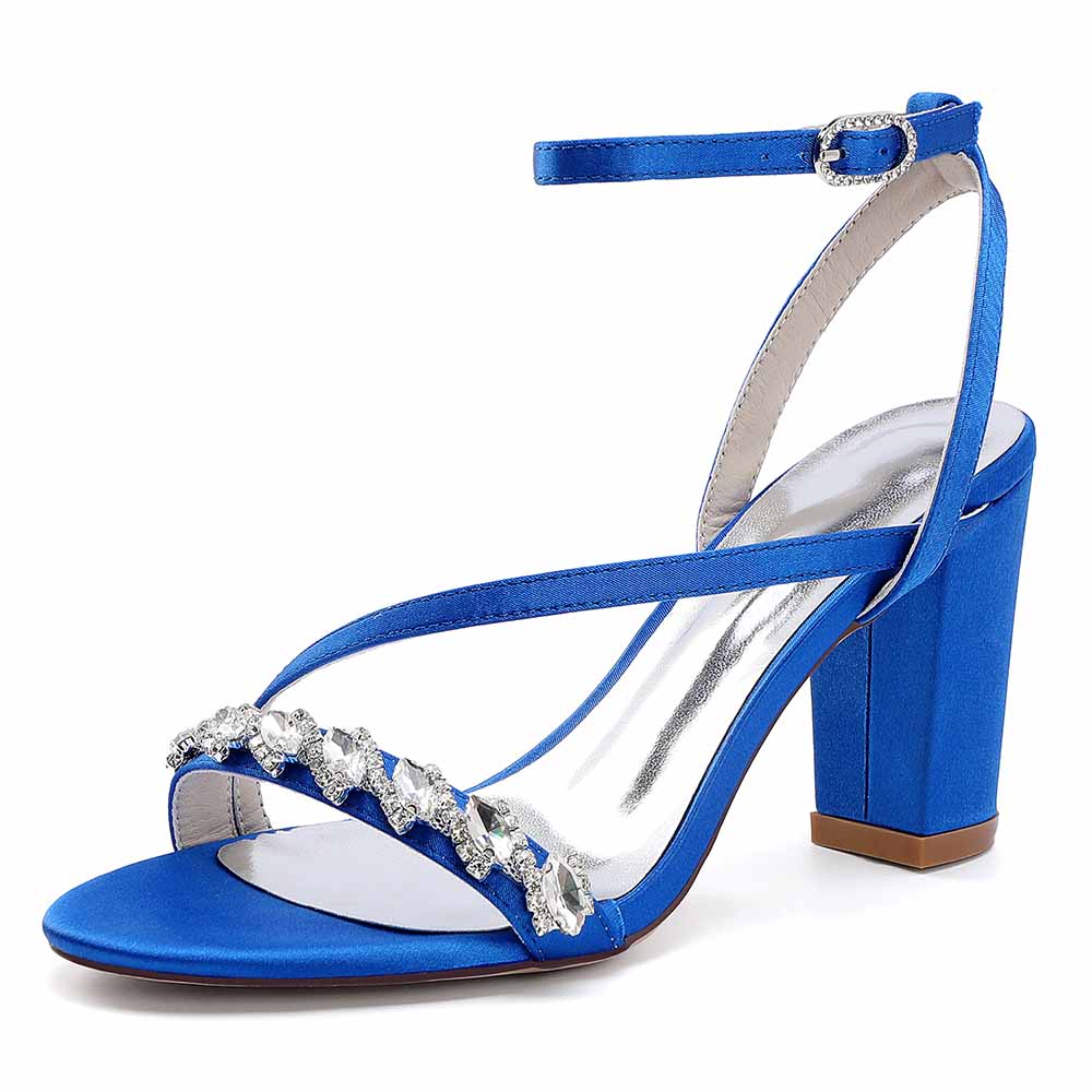 Elegant ankle strap dress shoes in blue satin with jewel embellishments and a chunky heel