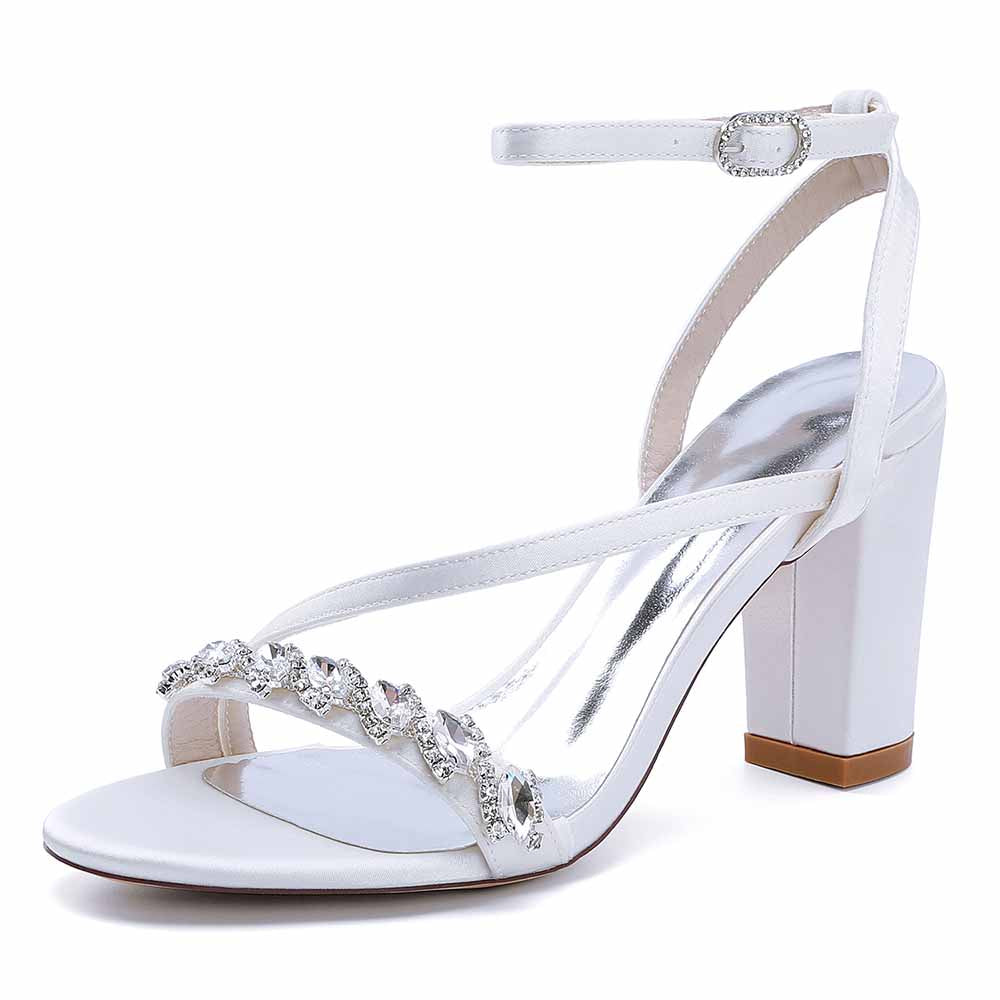 Elegant ankle strap dress shoes in white with crystal embellishments and a block heel