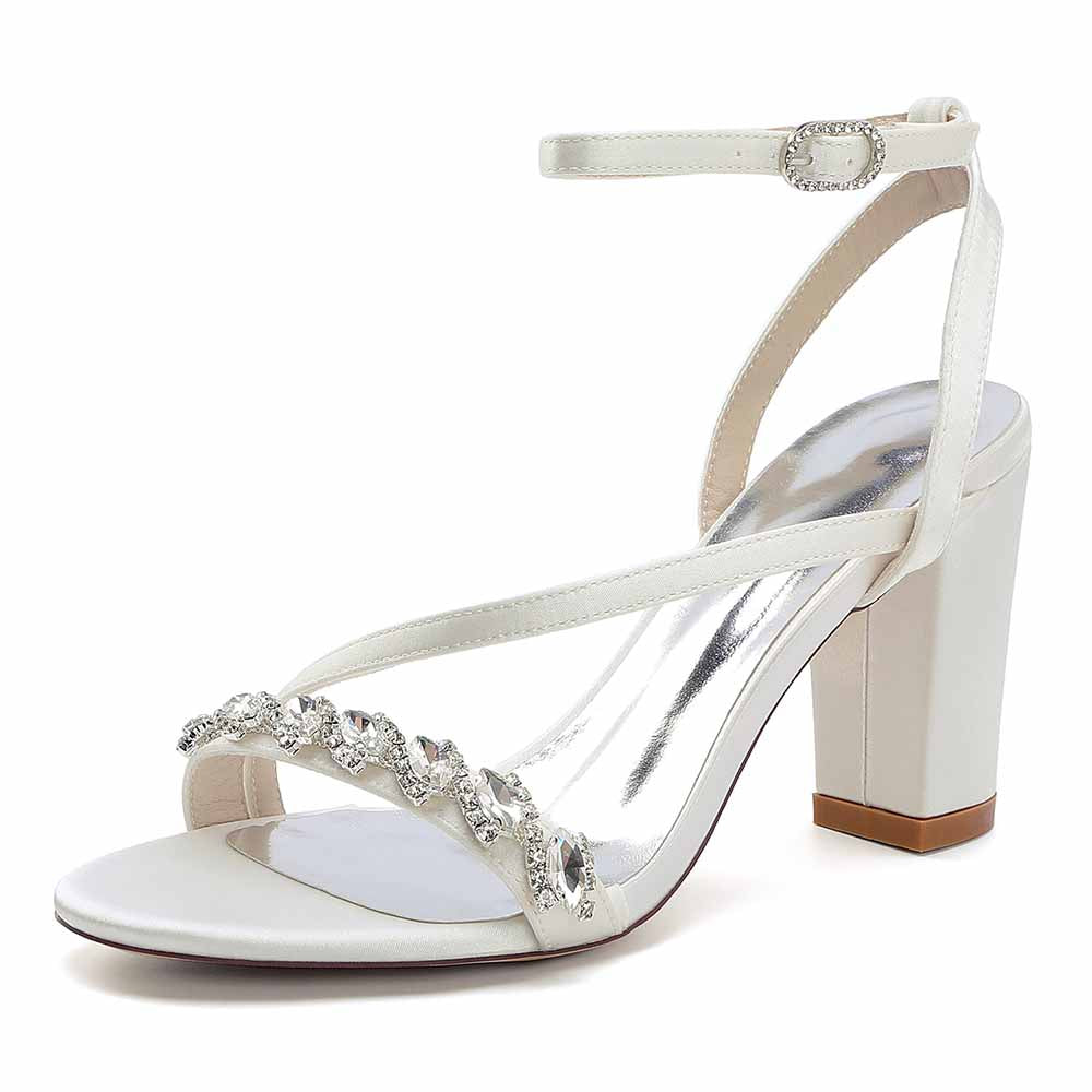Elegant ankle strap dress shoes with a shiny heel and decorative rhinestone detailing