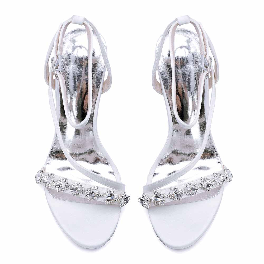 Elegant ankle strap dress shoes in silver with embellished detail for formal occasions