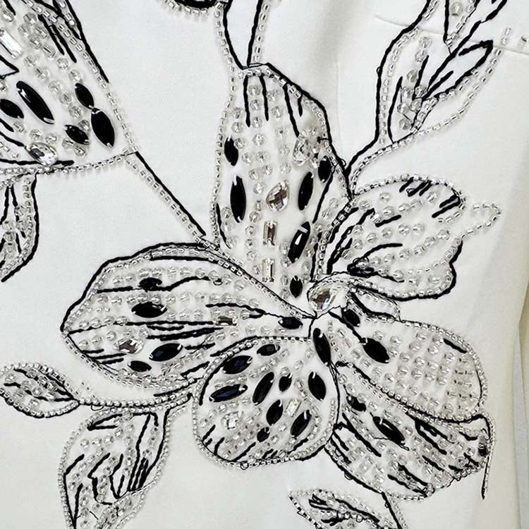 Embellished evening gown for prom featuring intricate floral beadwork and sequins design