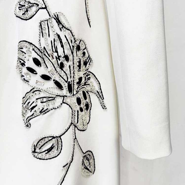 Embellished evening gown for prom featuring elegant floral embroidery and intricate beading detail