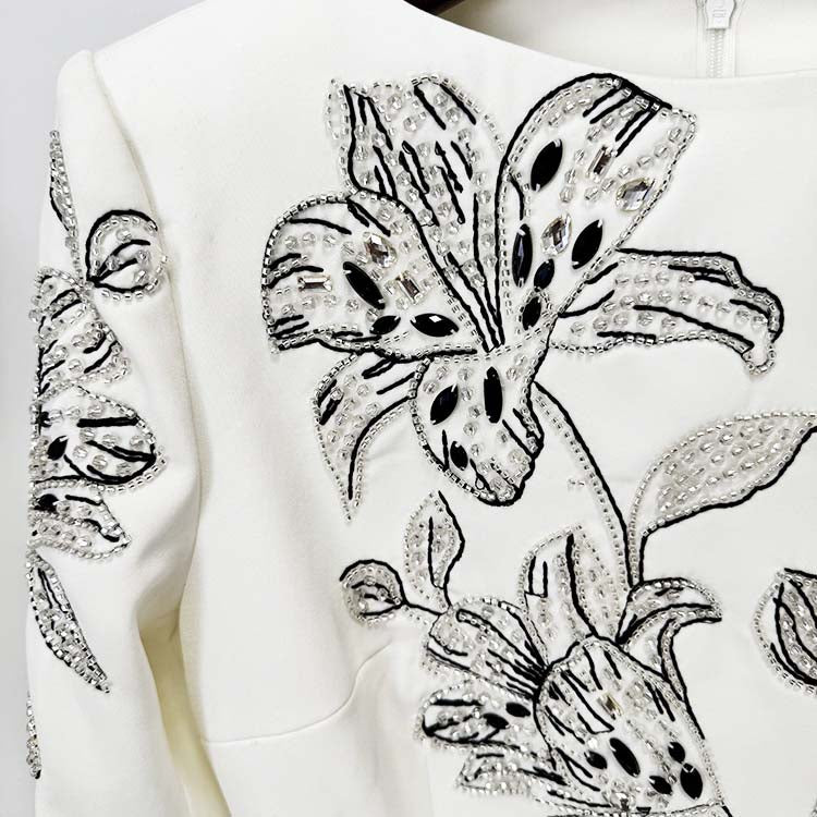 Embellished evening gown for prom with detailed beadwork and floral design on the bodice