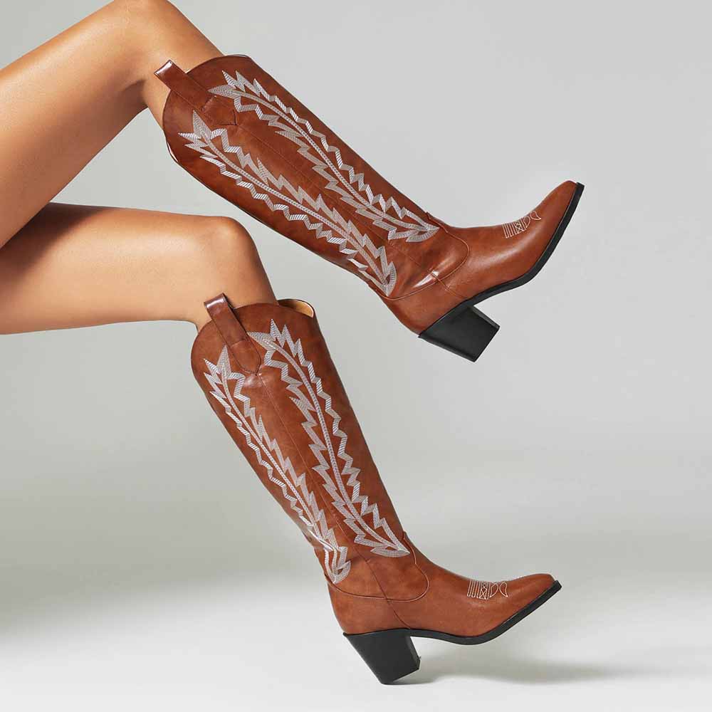 Embroidered cowgirl boots for women in brown with decorative stitching and a stylish heel
