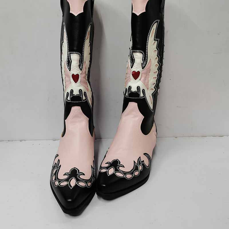 Pink and black embroidered western cowboy boots for women with intricate designs and pointed toes