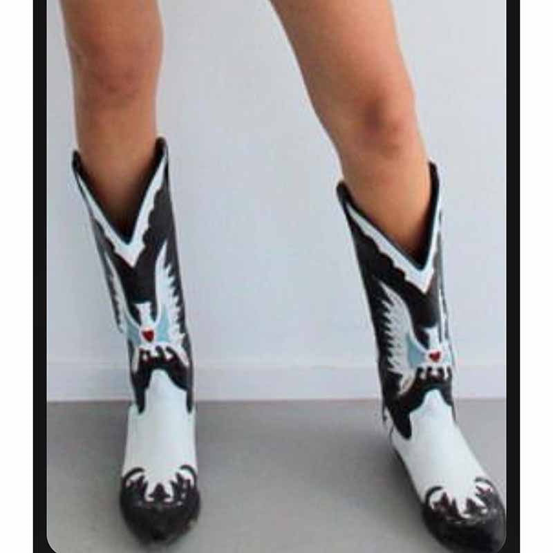 Embroidered western cowboy boots for women featuring intricate designs and tall shafts