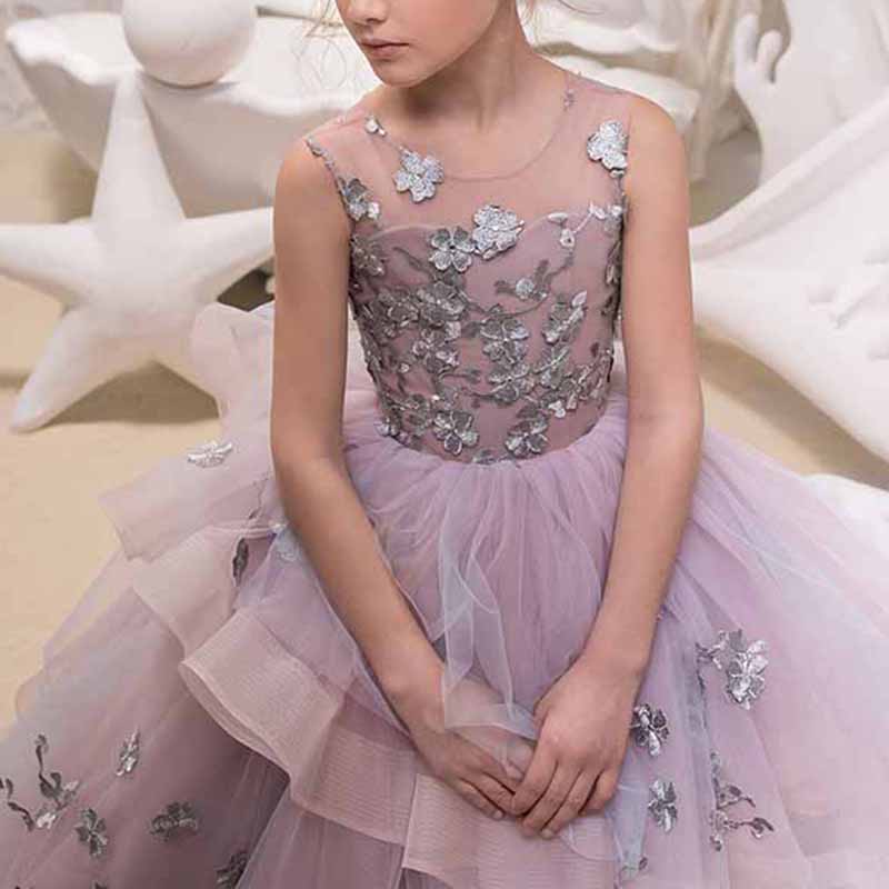 Beautiful floor length ball gown for girls with floral embellishments and layered tulle skirt