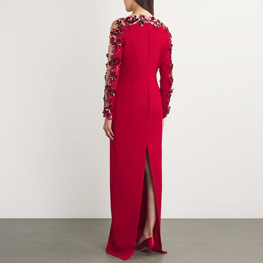 Elegant red floral embellished formal gown with long sleeves and open back detail