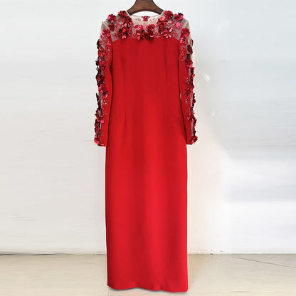 Elegant red floral embellished formal gown with intricate flower detailing on sleeves
