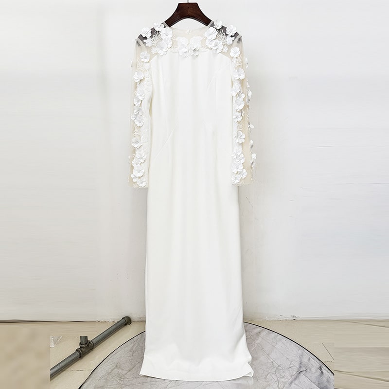 Elegant white floral embellished formal gown with long sleeves and intricate floral details