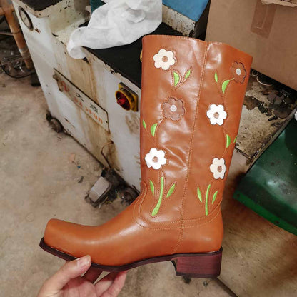 Brown floral embroidered boots featuring vibrant flower designs and a stylish silhouette