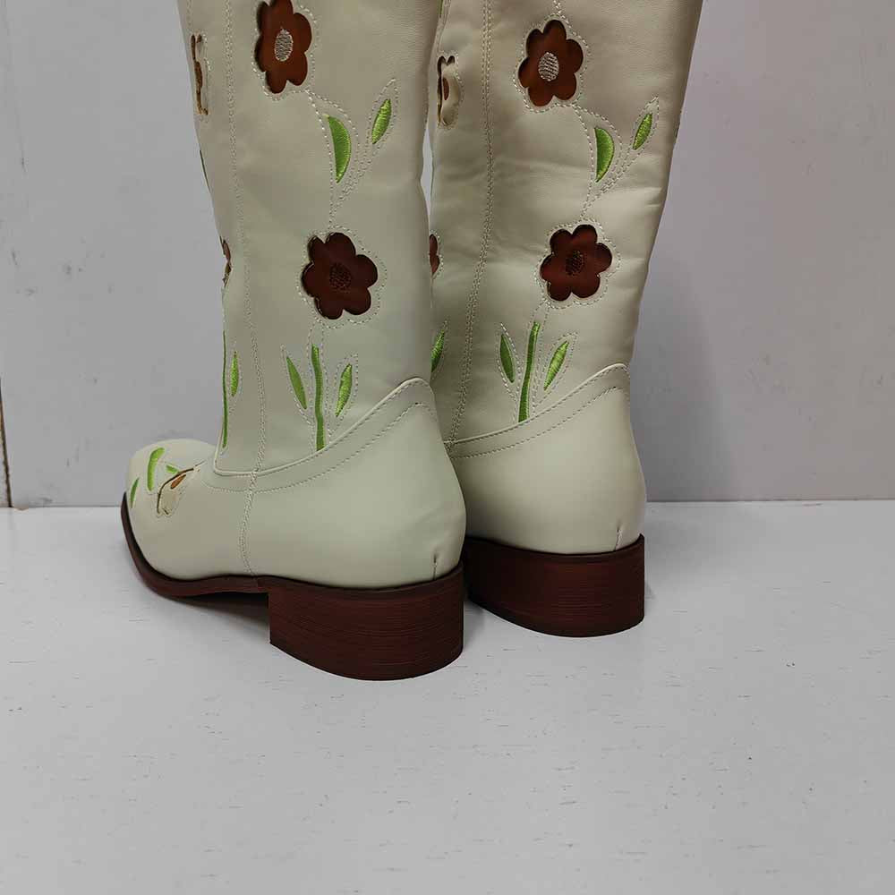 Cream floral embroidered boots with colorful flower designs and a low heel for a stylish touch