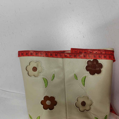 Floral embroidered boots with vibrant flower patterns and green leaf details for a stylish look