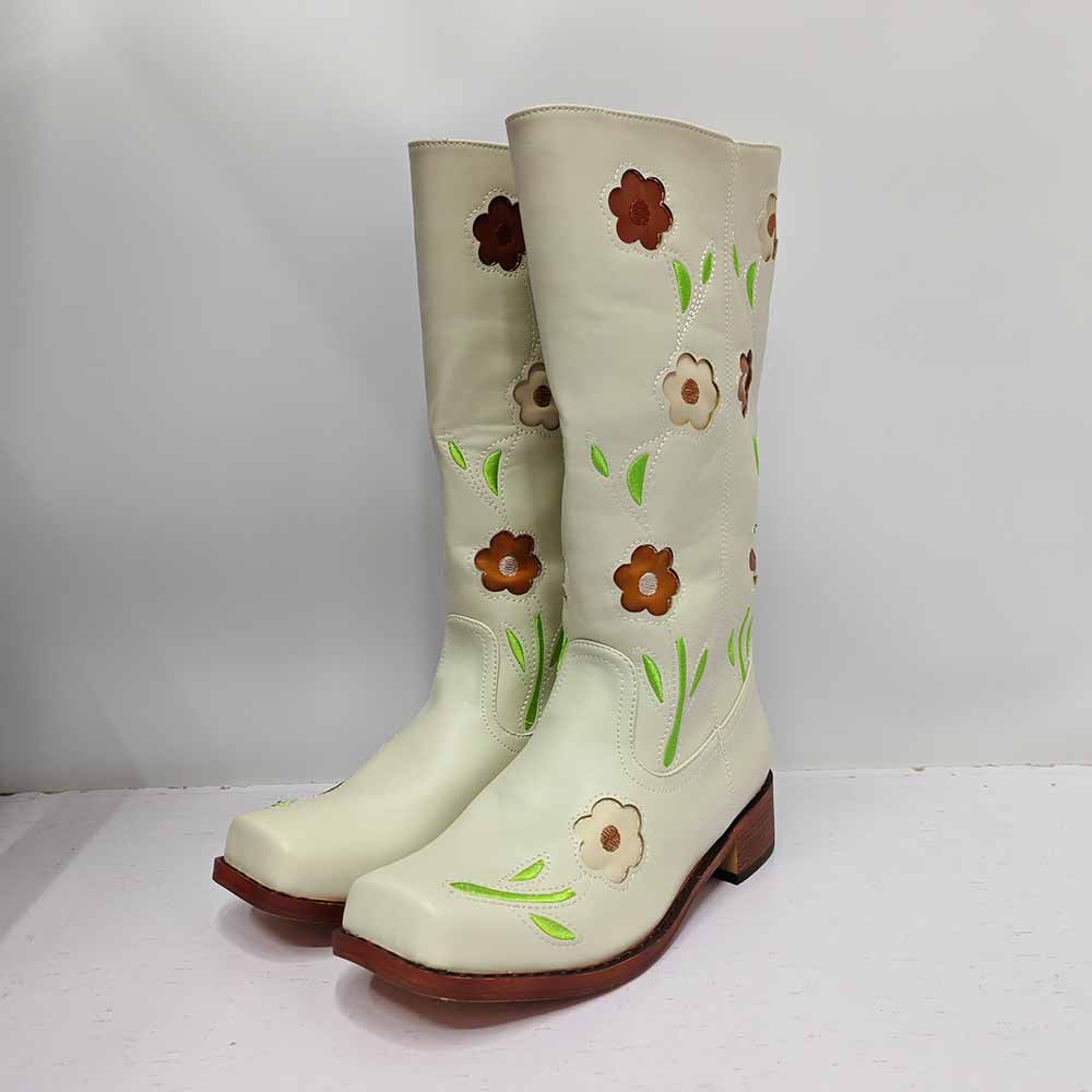Stylish floral embroidered boots in white with colorful flower designs for a trendy look