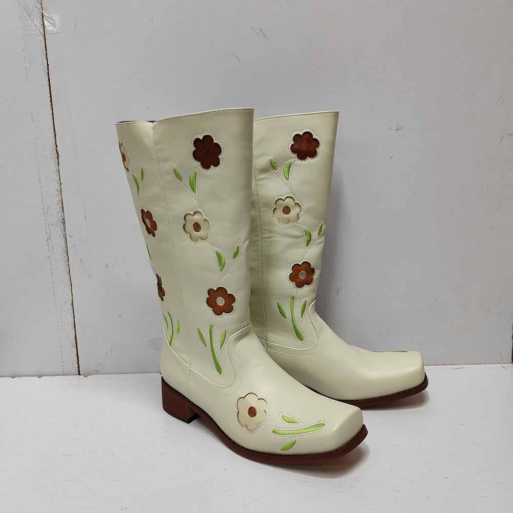 Floral embroidered boots in white with colorful floral designs on the shaft for a stylish look