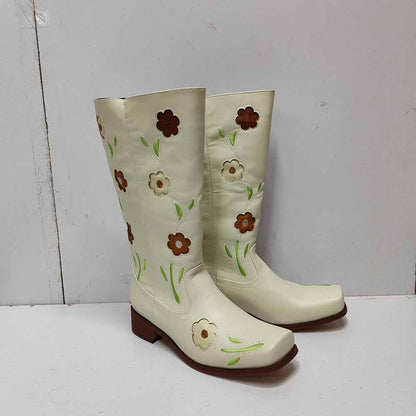 Floral embroidered boots in white with colorful floral designs on the shaft for a stylish look