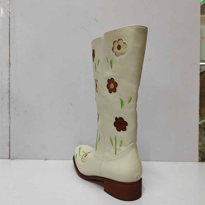 Cream floral embroidered boots featuring colorful flower designs and a low heel for stylish comfort